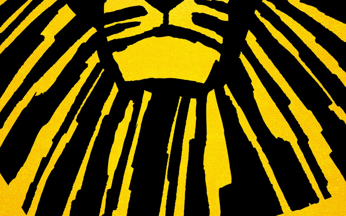 Logo des Musicals "Disneys DER KÖNIG DER LÖWEN" mit einem stilisierten Löwenkopf.